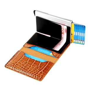 Detail view of brown crocodile texture wallet with RFID metal card pop-up slot and cash clip