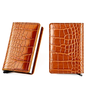 Detail of dark brown crocodile pattern card holder with RFID blocking and pop-up button