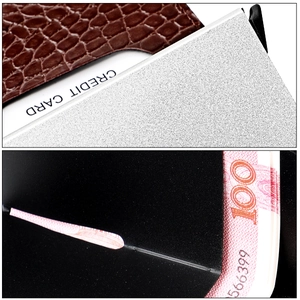 Detail of brown crocodile pattern wallet featuring automatic pop-up card slot and bill holder