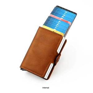 Detailed view of brown leather RFID card holder with automatic pop-up aluminum wallet mechanism