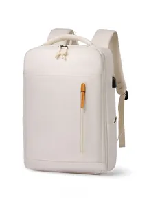 Side view of minimalist commuter backpack showing external USB charging port and zipper