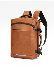 Brown leather laptop backpack with dual handles and side buckle detail in a side view