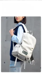 Large capacity off-white travel backpack with adjustable straps shown in a lifestyle view