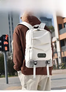 Detail of a large beige and grey travel backpack with Believe In Yourself leather patch