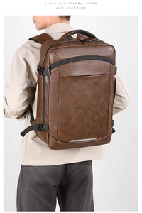 Deep brown leather-textured business backpack with buckled side detail and sleek finish