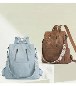Detail view of anti-theft backpacks with wide geometric straps and multi-layer storage