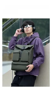 Close-up of olive green tactical backpack with waterproof fabric and multi-pocket design