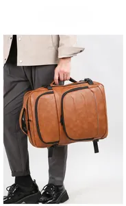 Brown PU leather business backpack with lateral handle and multiple functional zip pockets