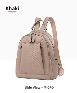 Detail view of khaki backpack with V-shaped quilting and premium lychee texture