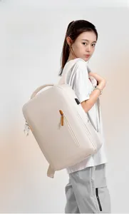 Detail of off-white commuter backpack featuring hidden zipper and USB charging port