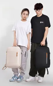 Detail of minimalist business backpack featuring external USB charging port and sleek design