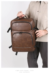 Detail of brown litchi pattern leather business backpack with reinforced top handle