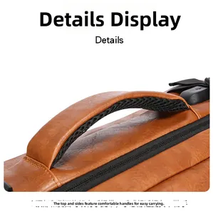 Detail of the brown leather backpack handle with breathable mesh padding and metal zipper