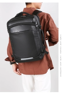 Detail of the high-quality lychee texture synthetic leather on a black business backpack