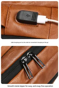 Detail of brown PU leather backpack with external USB charging port and smooth metal zippers