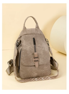 Close-up of large capacity PU leather backpack featuring ethnic geometric woven straps