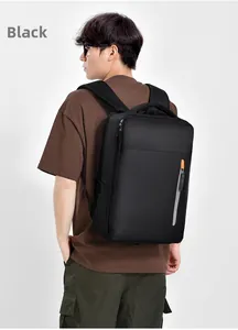Rear view of large black business backpack with orange zipper accents on a male model
