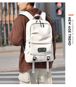 Minimalist beige travel backpack with multiple zippered compartments and grey straps