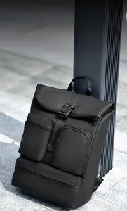 Detail of waterproof black business backpack with buckle closure and functional zip pockets