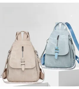 Detailed texture of large capacity soft PU leather backpacks in beige and light blue