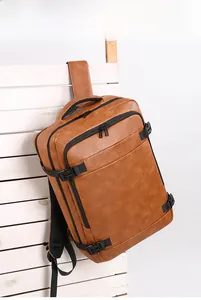 Close-up of brown PU leather backpack with side buckle and textured grain finish