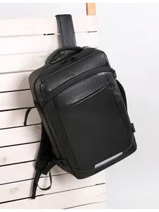 Detail of waterproof black business backpack with reflective safety strip and padded handle