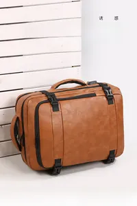 Detailed view of brown PU leather travel backpack featuring multiple zipper compartments