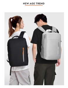 Vertical front zipper pocket detail on waterproof business commuter backpack in gray