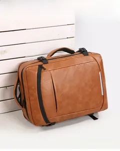 Macro detail of brown leather business backpack featuring zip compartments and reflective strip