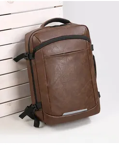 Macro shot of brown pebble grain PU leather backpack with side buckle and side pocket