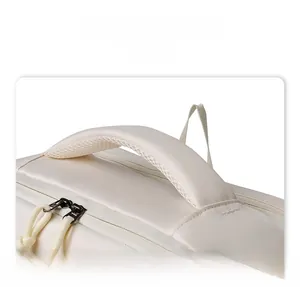 Detail display of the beige business backpack featuring a padded breathable mesh handle