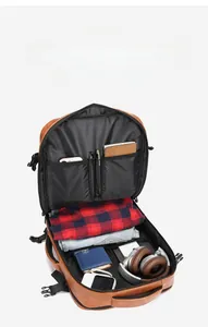 Detailed view of the large capacity multi-compartment interior for brown PU leather backpack