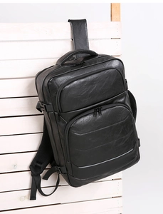 Macro shot of breathable mesh padding and adjustable ergonomic straps on a black backpack