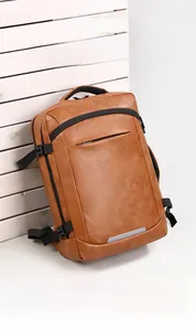 Detail of brown leather business backpack showing water-resistant fabric and buckle