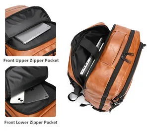 Detail view of brown PU leather backpack showing multi-pocket storage and laptop compartment