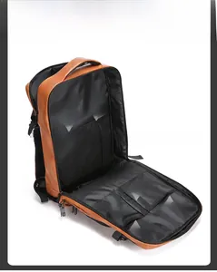 Detail view of brown leather backpack interior with laptop compartment and mesh pockets
