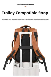 Brown PU leather travel backpack featuring a back strap for suitcase handle attachment