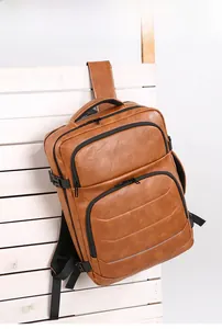 Detail of vintage brown business backpack with leather texture and breathable mesh straps