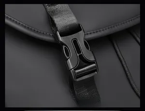 Close-up of durable black plastic front buckle and nylon strap on a waterproof backpack