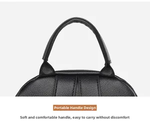 Close-up of a black pebbled leather backpack handle with durable stitching and soft texture