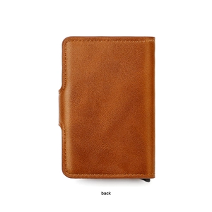 Detail view of the brown leather back texture and stitching of the RFID aluminum wallet