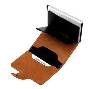 Detail view of the brown leather RFID wallet with its internal pop-up card mechanism