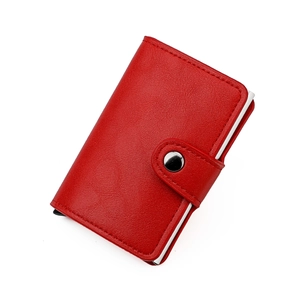 Detail of red lychee leather RFID card holder with metallic pop-up slot and snap button