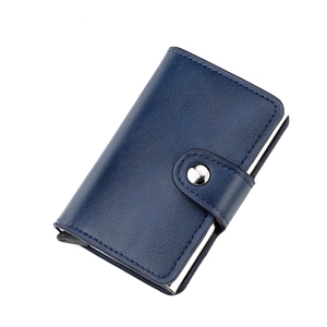 Detail of navy blue pebble leather RFID wallet with silver metal snap closure