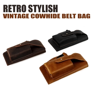 Close-up of three vintage cowhide leather belt pouches in dark brown, black, and light tan