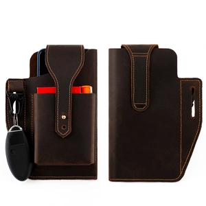 Detail of crazy horse leather belt pouch showing phone, key, and pen compartments