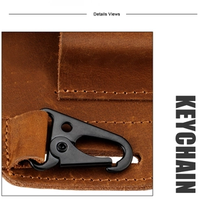 Macro detail of genuine leather belt pouch showing vintage texture and black metal keychain