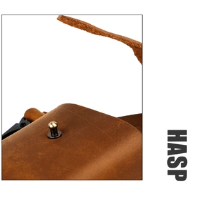 Detailed macro view of the vintage crazy horse leather belt pouch with a brass metal hasp
