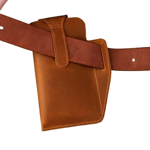 Vintage brown crazy horse leather cell phone holster attached to a leather waist belt