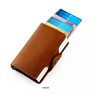 Detail of brown leather RFID card holder showing the automatic pop-up aluminum wallet mechanism